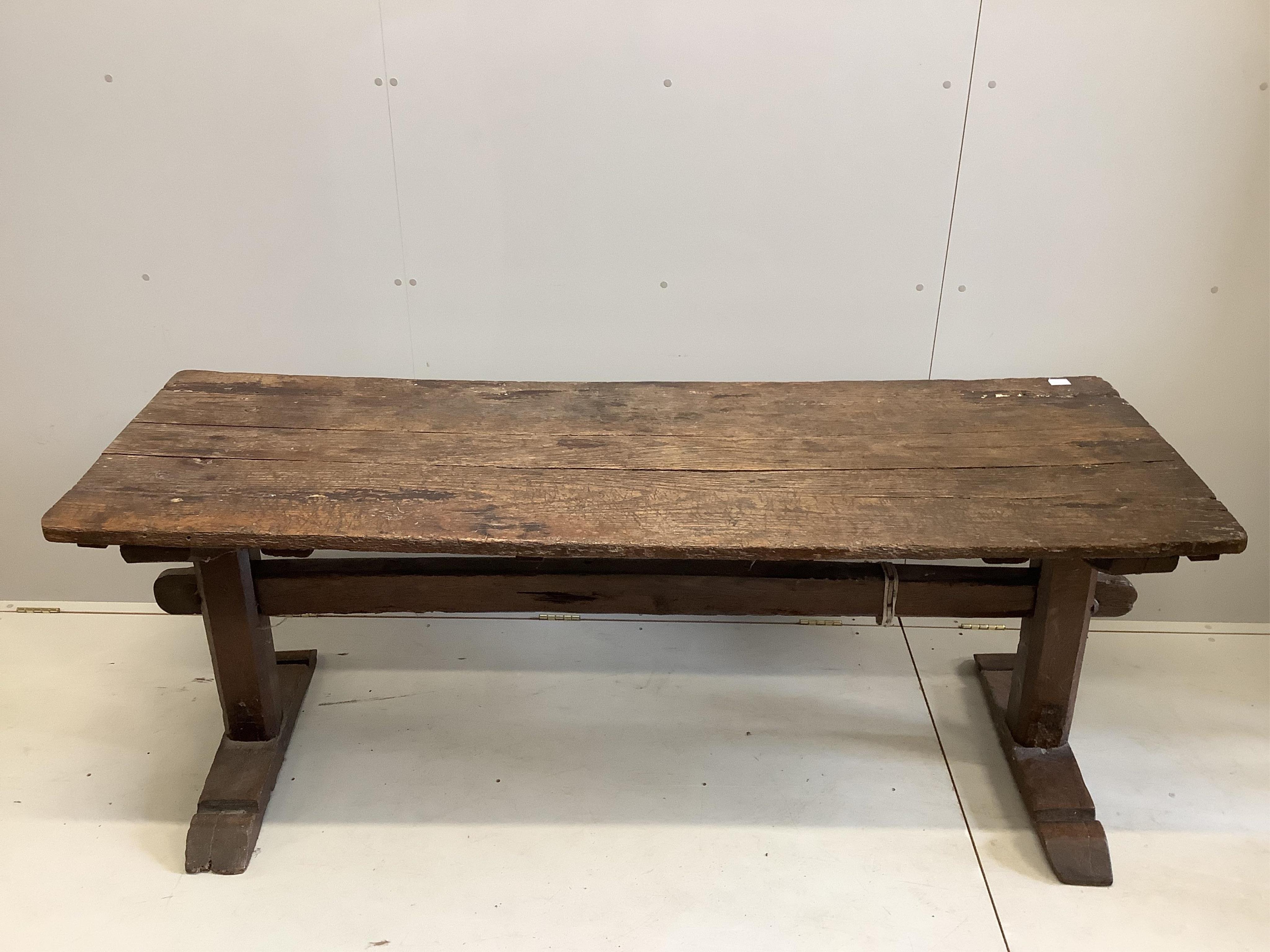 A 17th century elm topped oak refectory table, width 199cm, depth 69cm, height 75cm. Condition - poor-fair